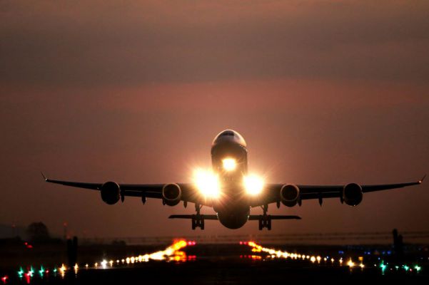 April-Plane-taking-off-at-sunset